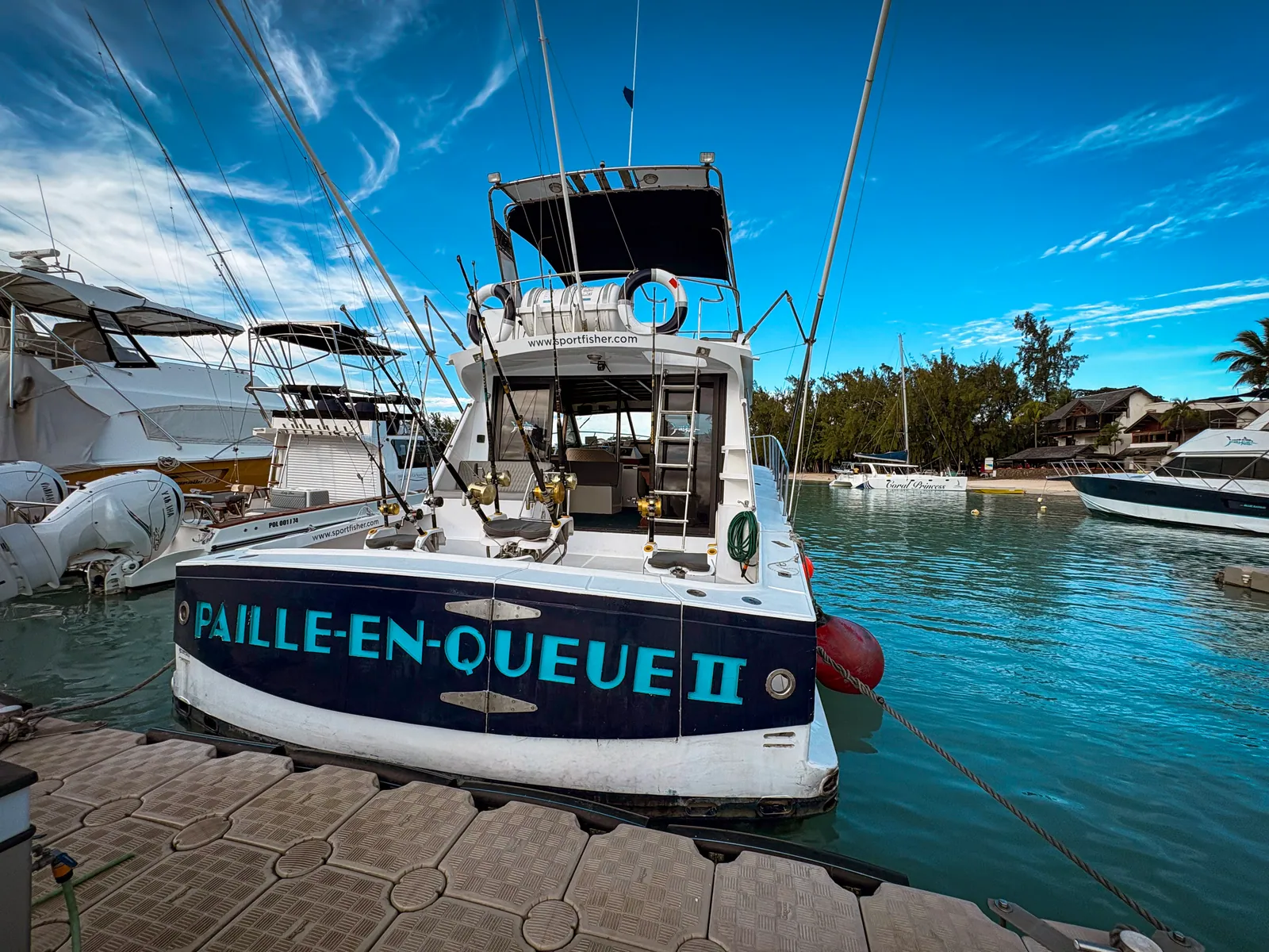 Stern of the boat Paille-en-Queue II at a dock.